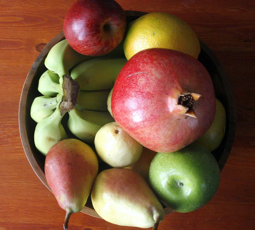 The Online Photo Dictionary: apple, bunch of bananas, lemon, bowl, table, pomegranate, pear, stem, green apple, orange
